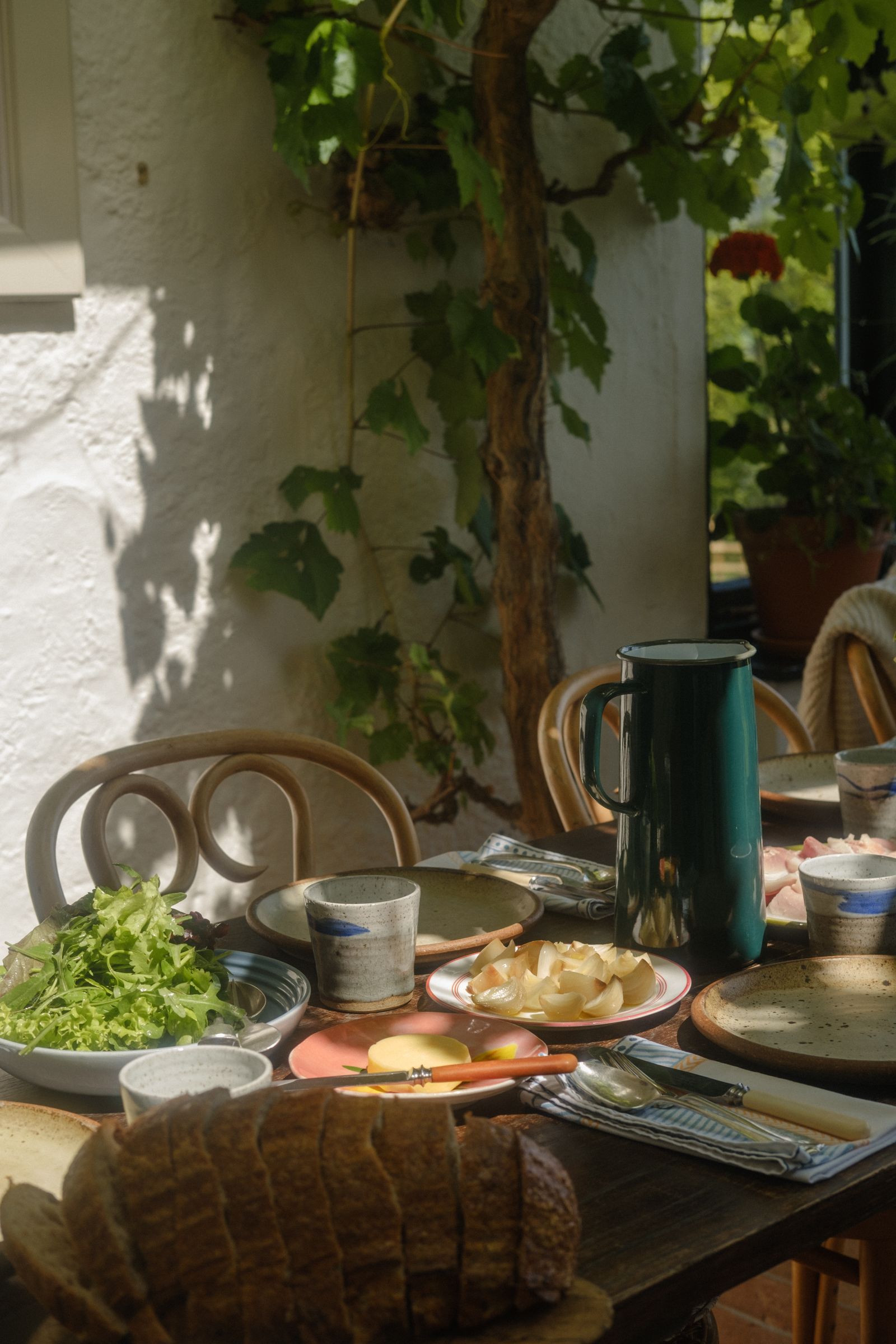 Image may contain Brunch Food Dining Table Furniture Table Plant Potted Plant Cup Architecture and Building