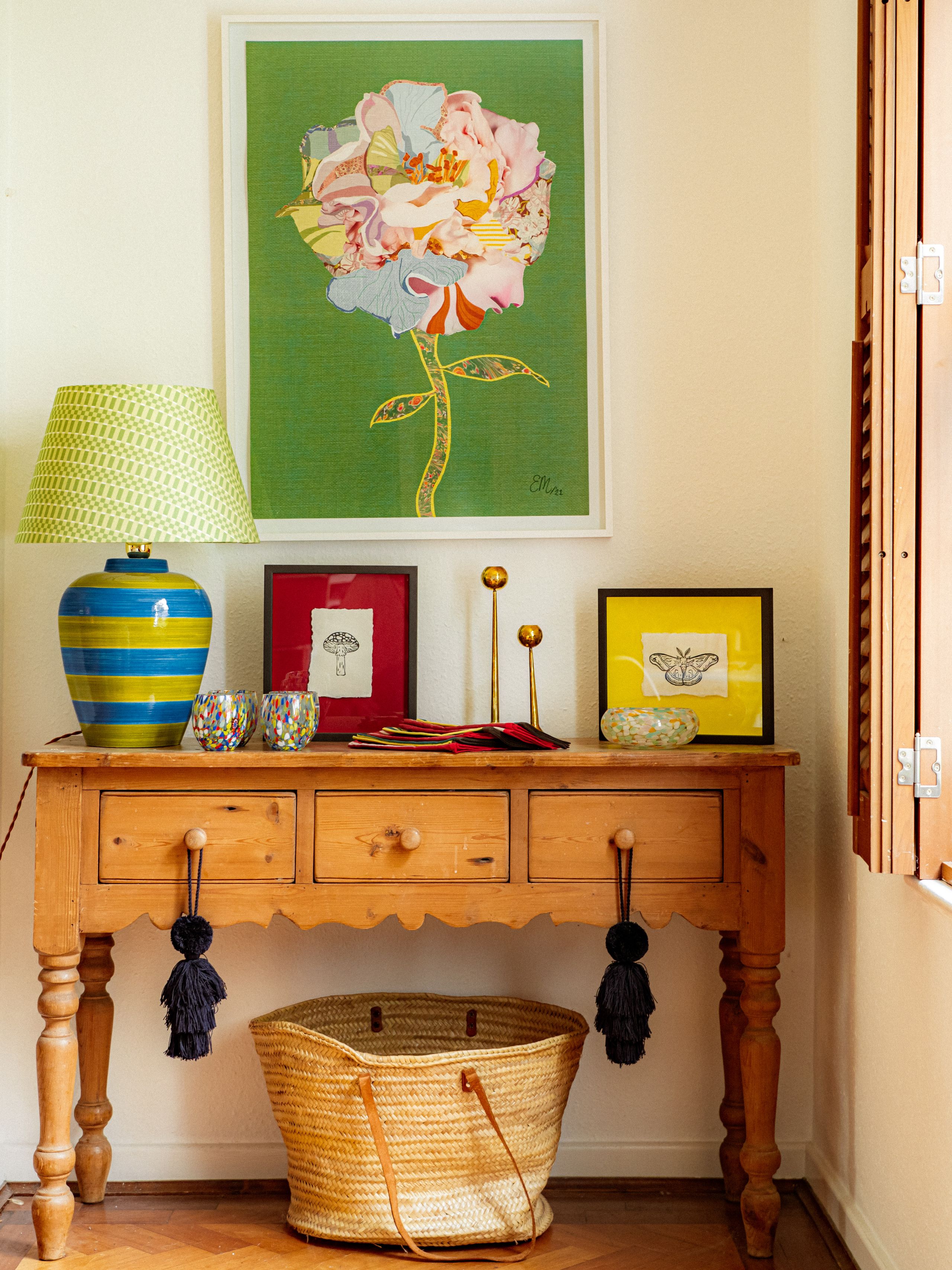 Image may contain: Lamp, Furniture, Sideboard, Art, Painting, Table Lamp, Indoors, Interior Design, Table, Desk, and Basket