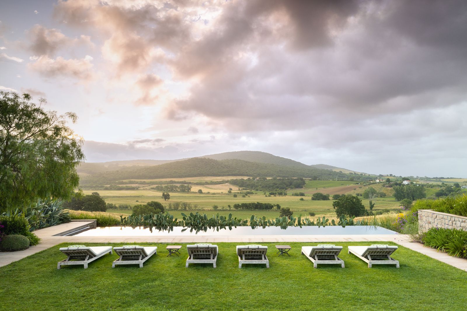 Image may contain Grass Plant Nature Outdoors Scenery Park Landscape Lawn Bench Furniture Backyard Yard and Sky