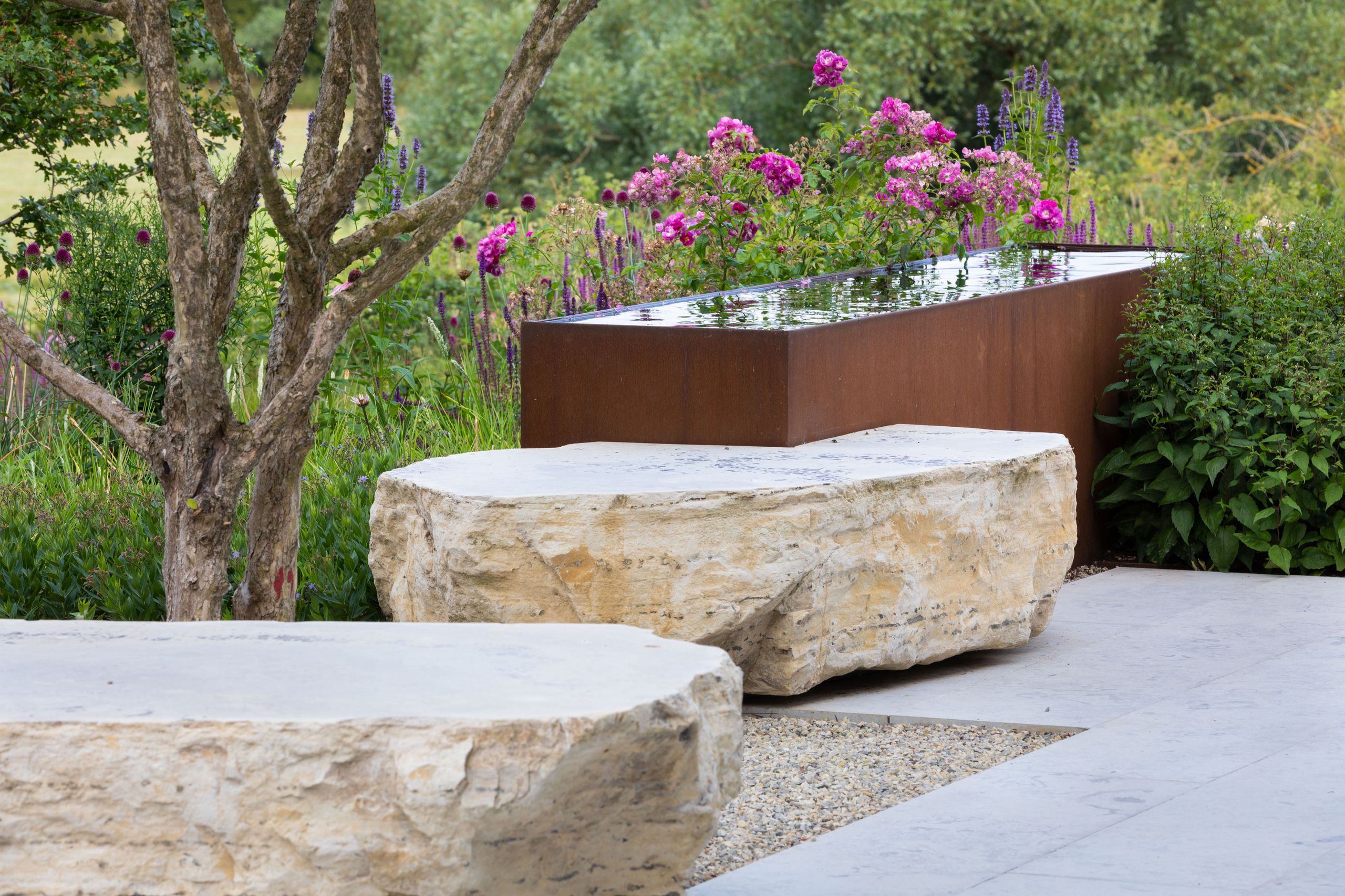 Image may contain: Plant, Potted Plant, Jar, Planter, Pottery, Vase, Tub, Path, Hot Tub, Backyard, Nature, Outdoors, and Yard