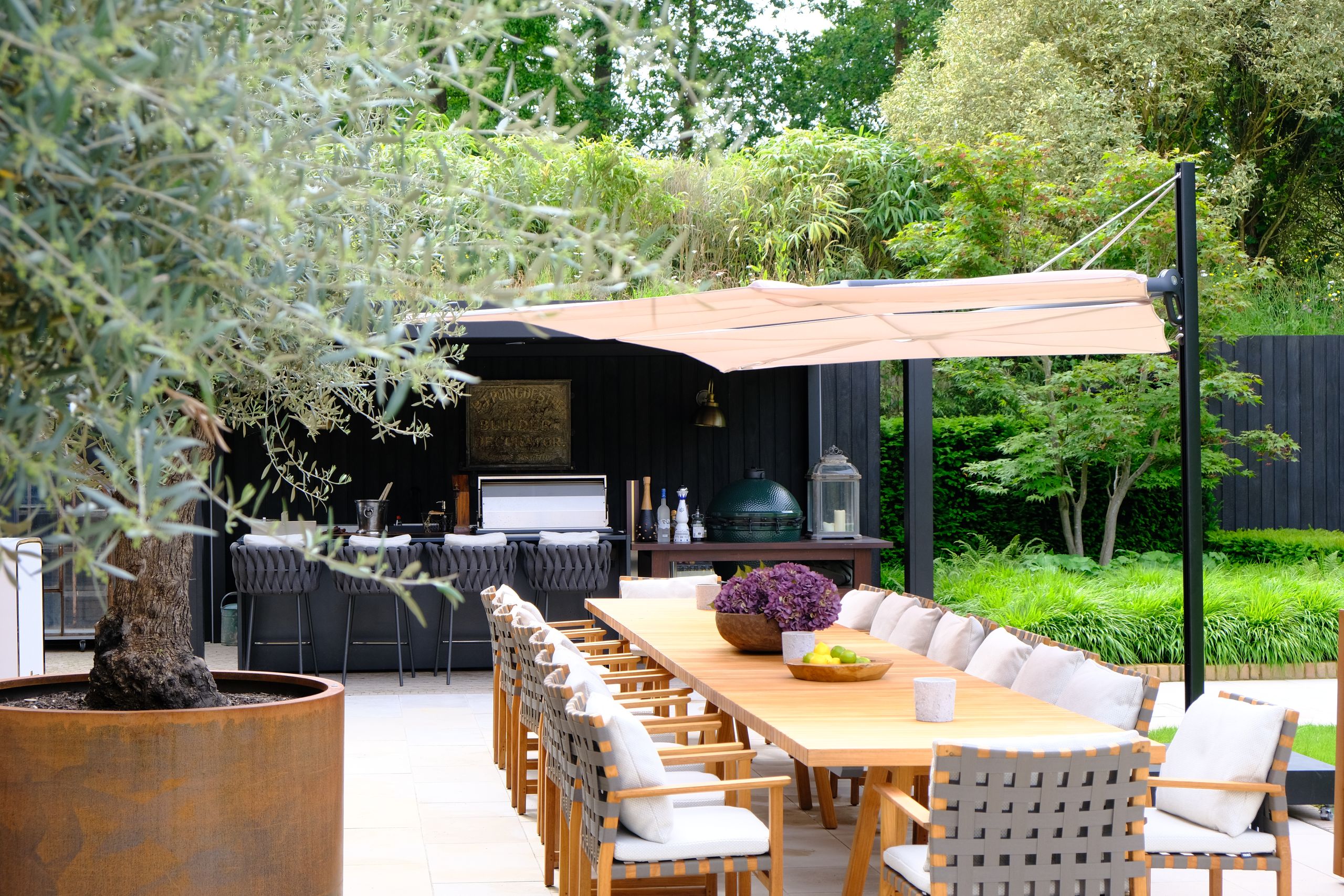 Image may contain: Indoors, Interior Design, Dining Table, Furniture, Table, Backyard, Nature, Outdoors, Yard, and Cup