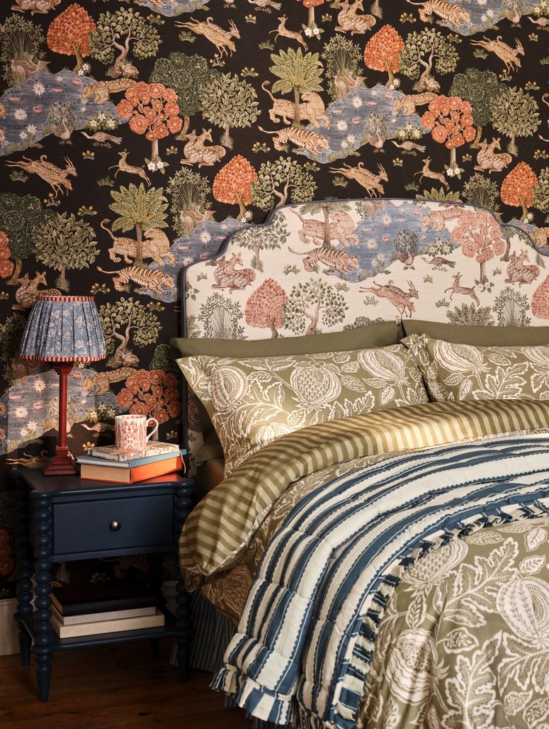 Image may contain: Lamp, Book, Publication, Cup, Furniture, Bed, Home Decor, Bedroom, Indoors, Room, and Table Lamp