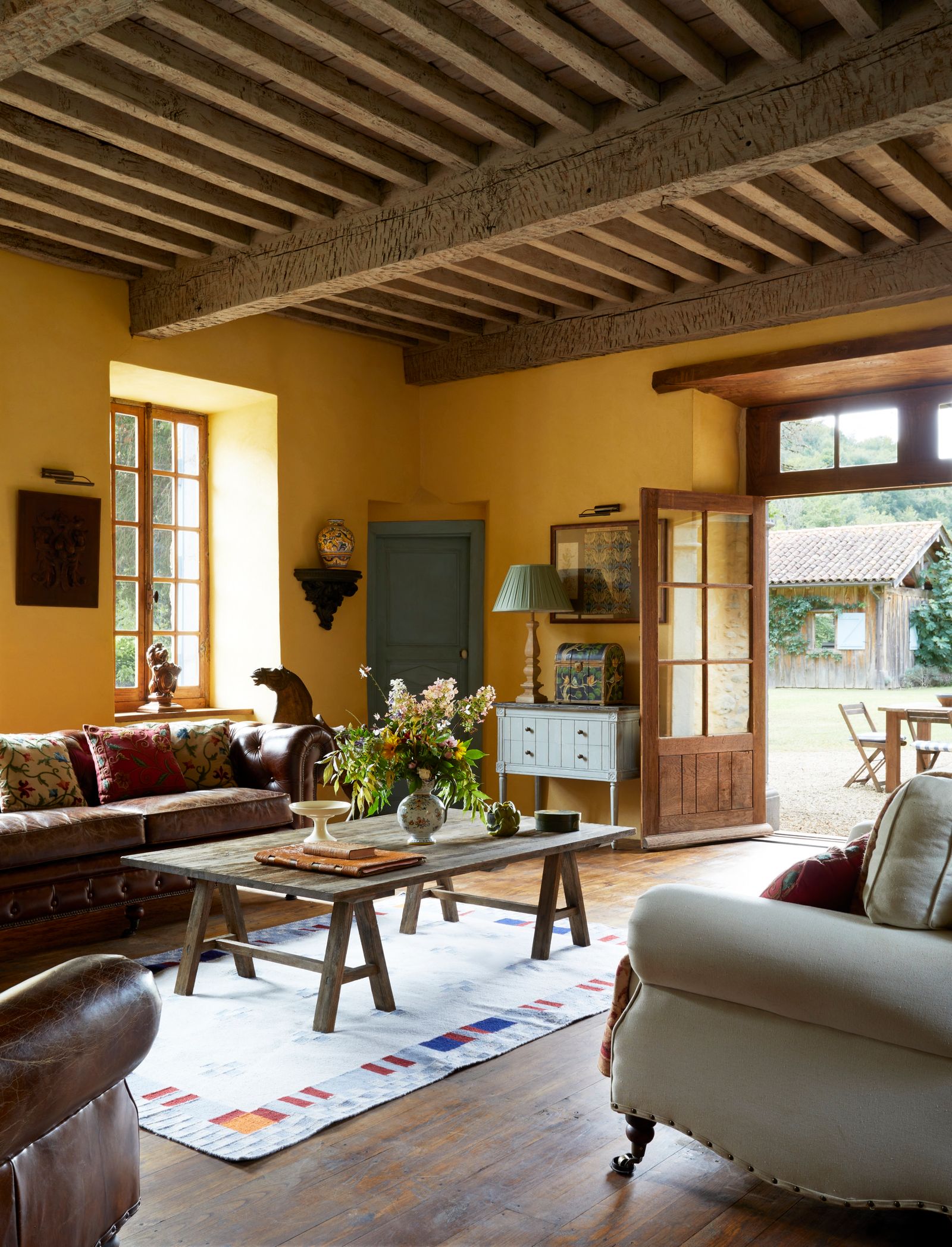 Image may contain Home Decor Lamp Architecture Building Furniture Indoors Living Room Room Coffee Table and Table