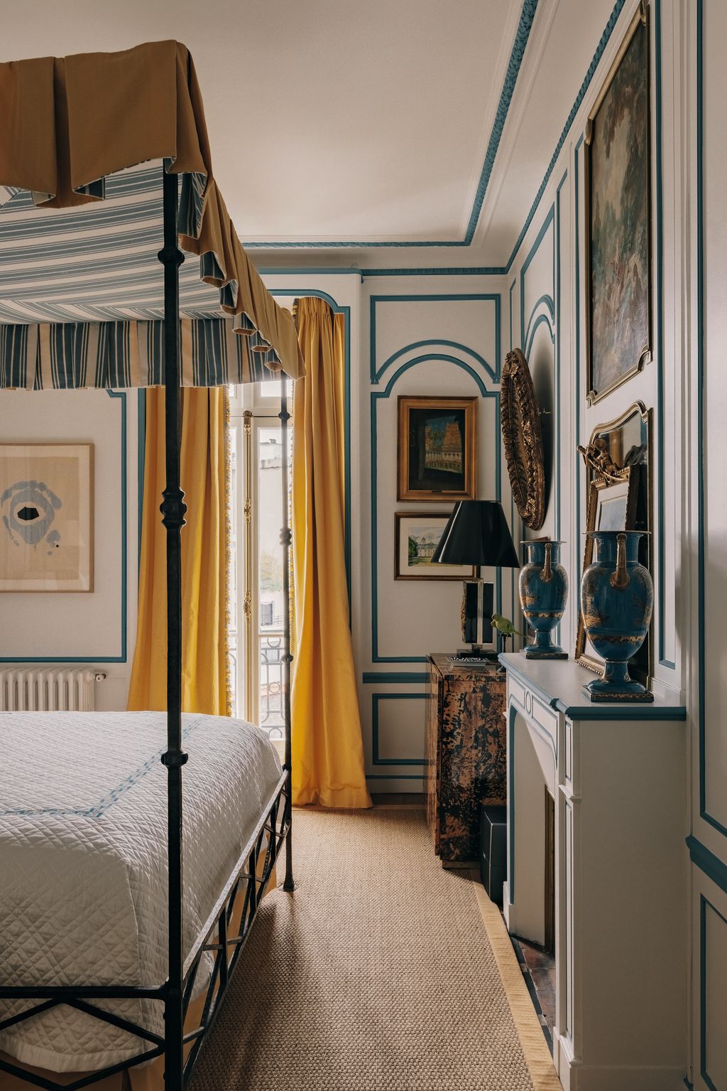 Image may contain Furniture Indoors Bed Bedroom Room Lamp Art Painting and Canopy Bed