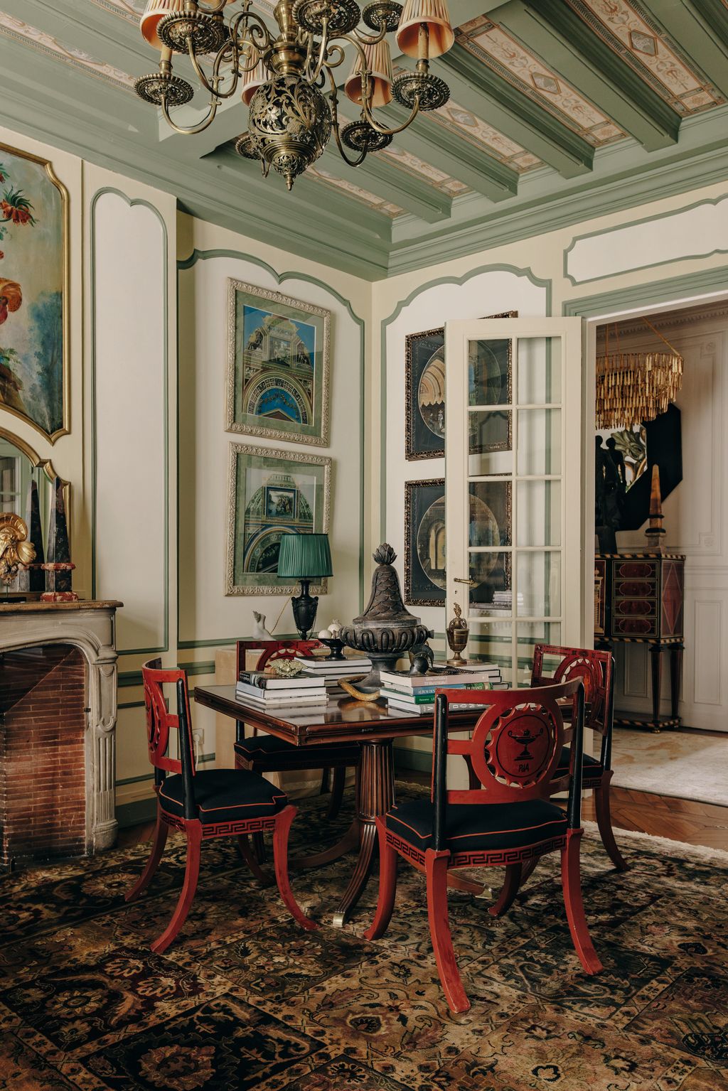 Image may contain Architecture Building Dining Room Dining Table Furniture Indoors Room Table Home Decor and Lamp