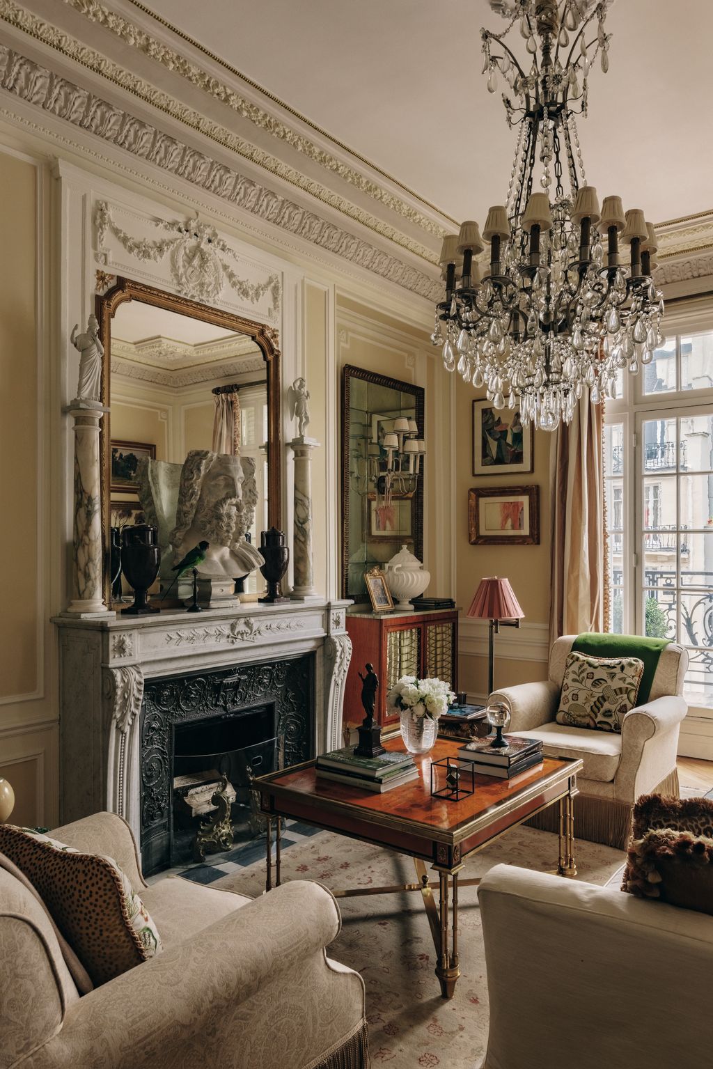 Image may contain Home Decor Chandelier Lamp Couch Furniture Person Table Art Painting Adult and Wedding