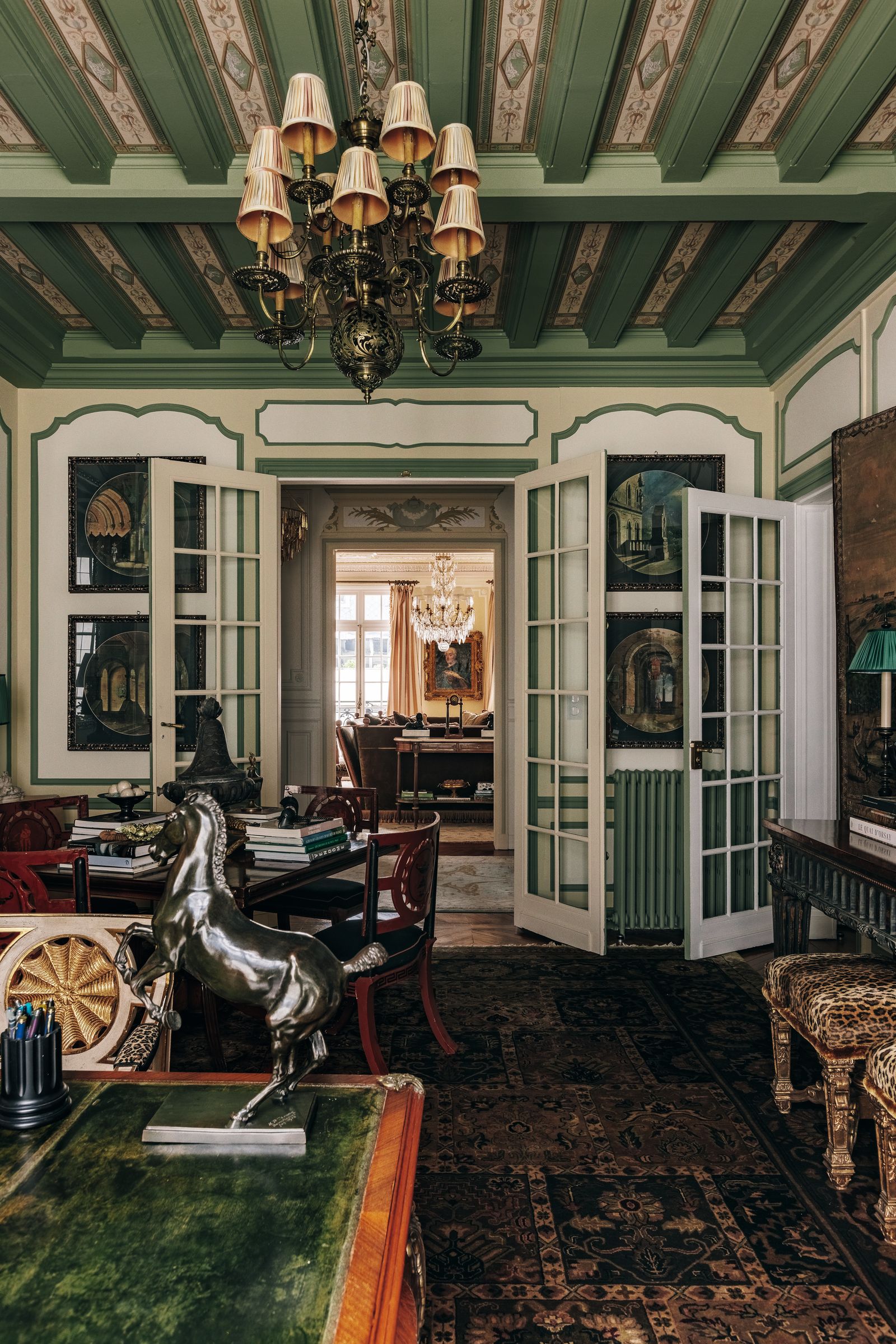 Image may contain Lamp Chandelier Door Chair Furniture Indoors Interior Design Art Painting and Architecture