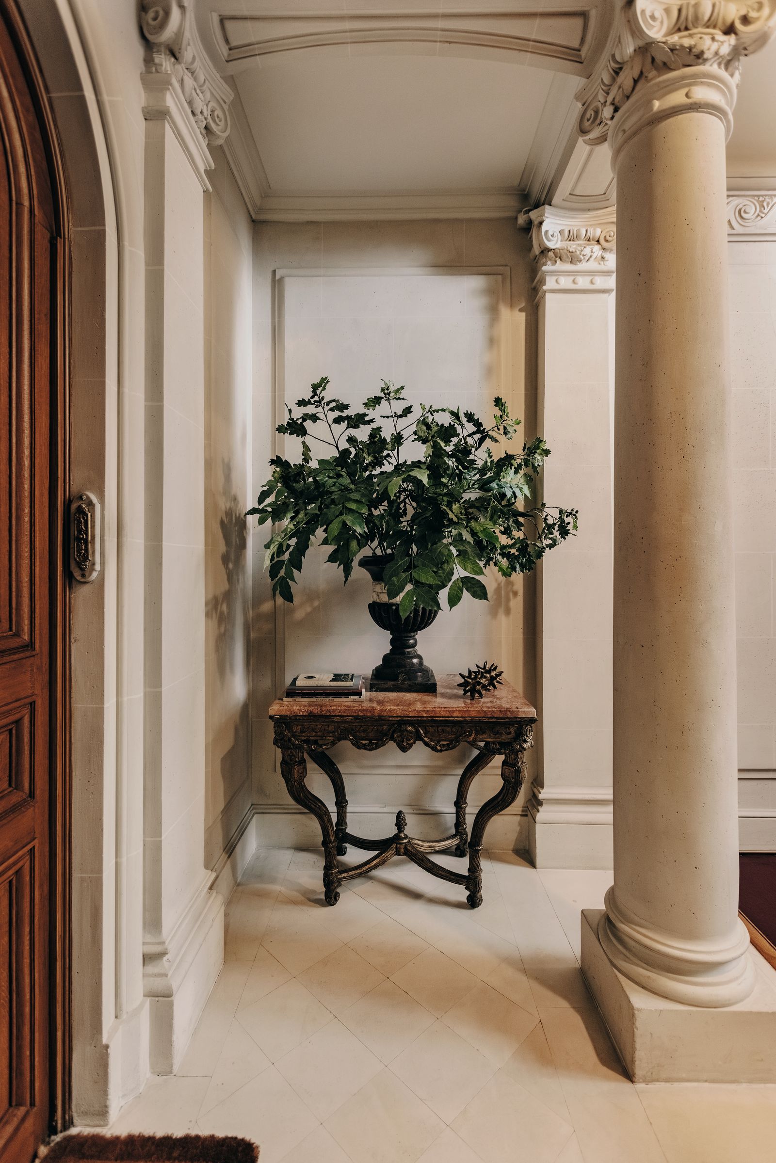 Image may contain Floor Indoors Interior Design Plant Flooring Architecture Building Foyer Desk and Furniture