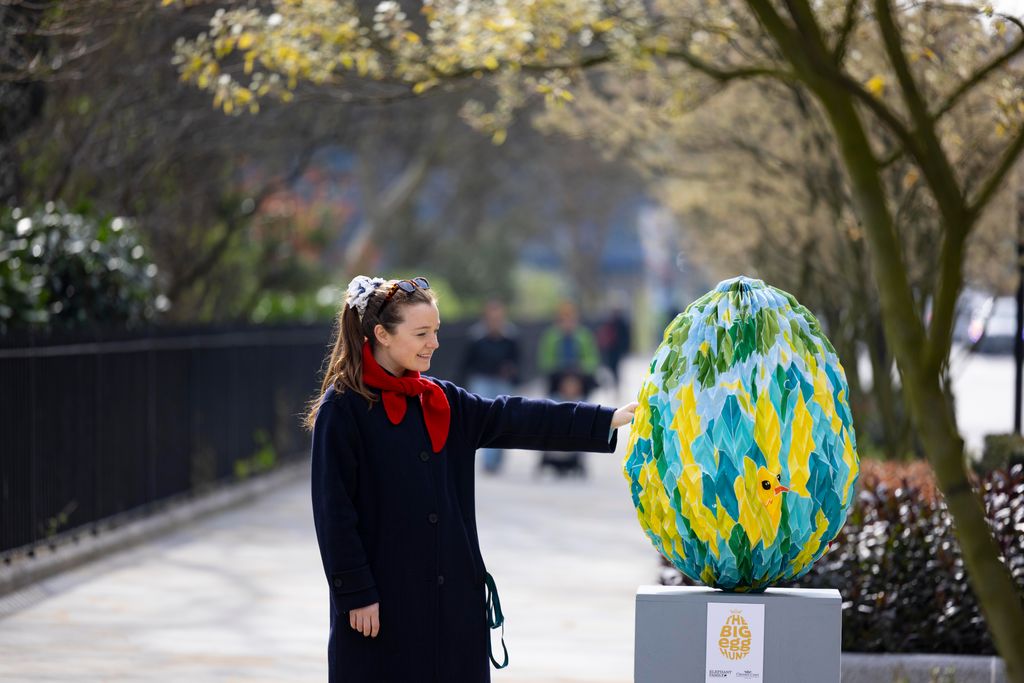 Image may contain Sphere Clothing Coat Person Grass Nature Outdoors Park Plant Accessories Glasses City and Head