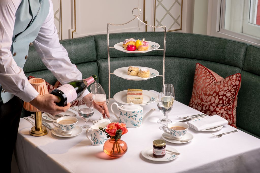 Image may contain Brunch Food Furniture Table Cup Dining Table Cutlery Fork Plate Tabletop Adult and Person