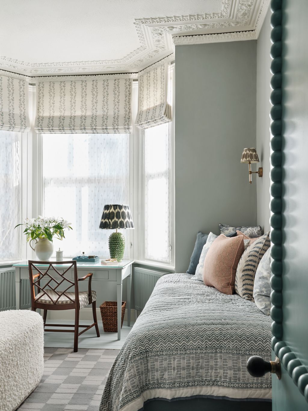 Image may contain Chair Furniture Bed Bedroom Indoors Room Desk Table Lamp Cup Home Decor Window and Bay Window