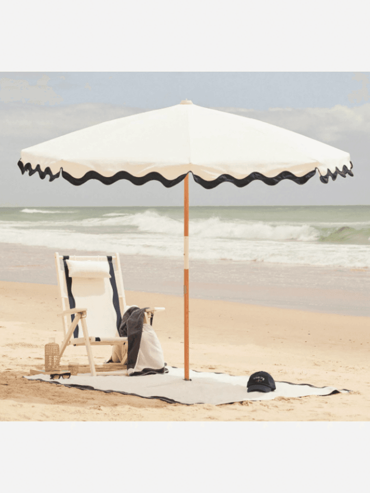 Image may contain Canopy Architecture Building House Housing Patio Patio Umbrella Chair Furniture Beach and Coast