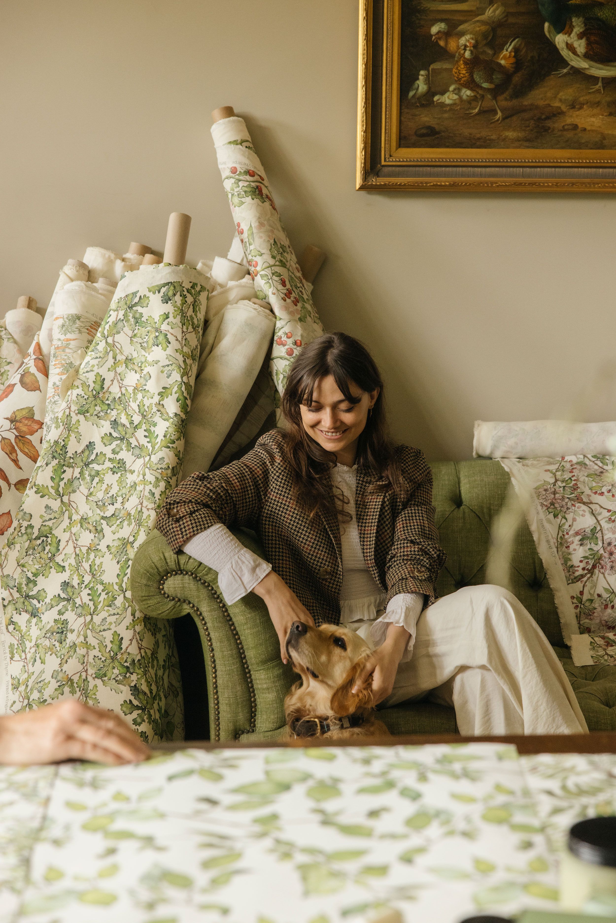 Image may contain: Couch, Furniture, Adult, Person, Cushion, Home Decor, Sitting, Face, Head, Photography, and Portrait