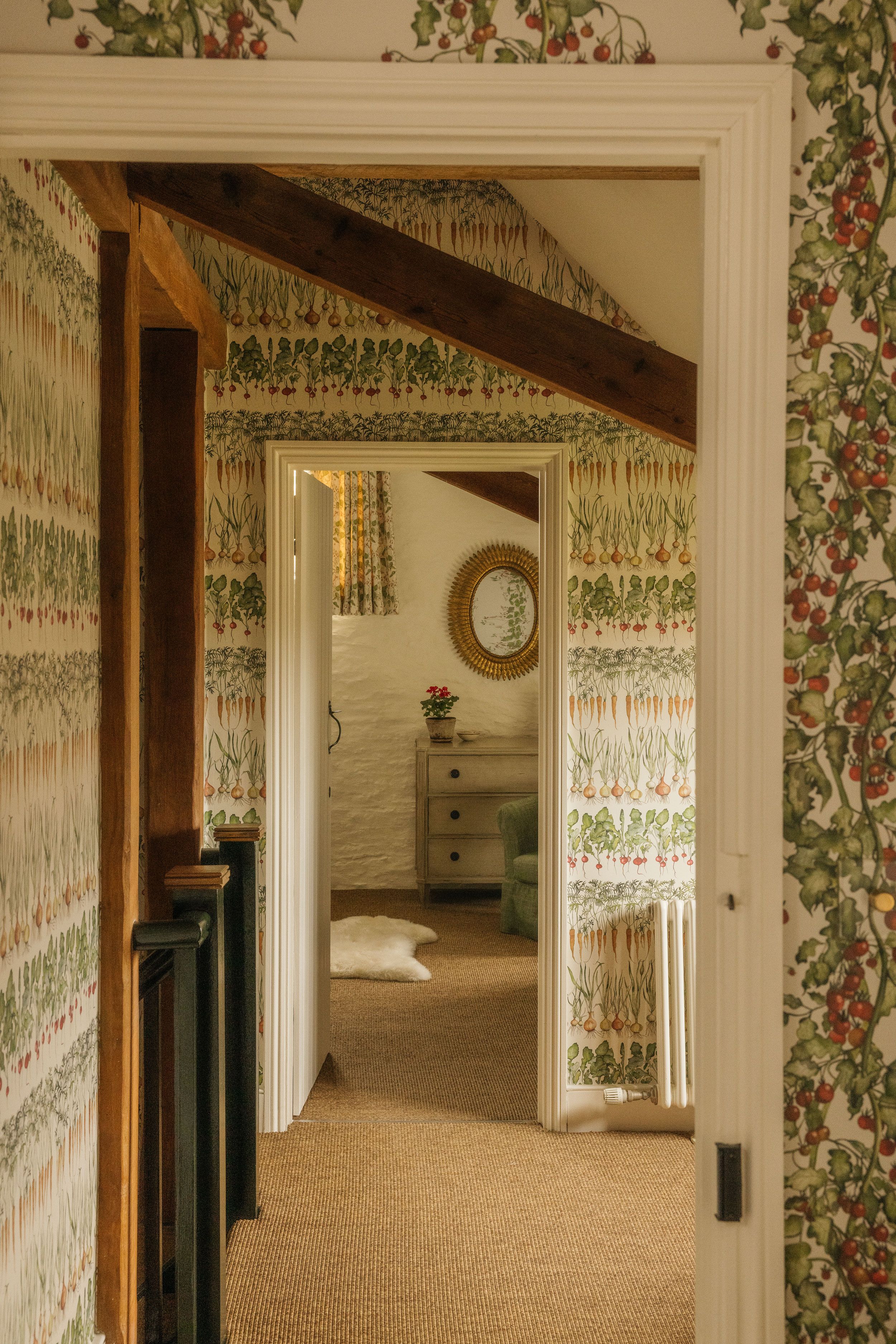 Image may contain: Indoors, Interior Design, Door, Couch, Furniture, Floor, Home Decor, Rug, Flooring, and Dressing Room