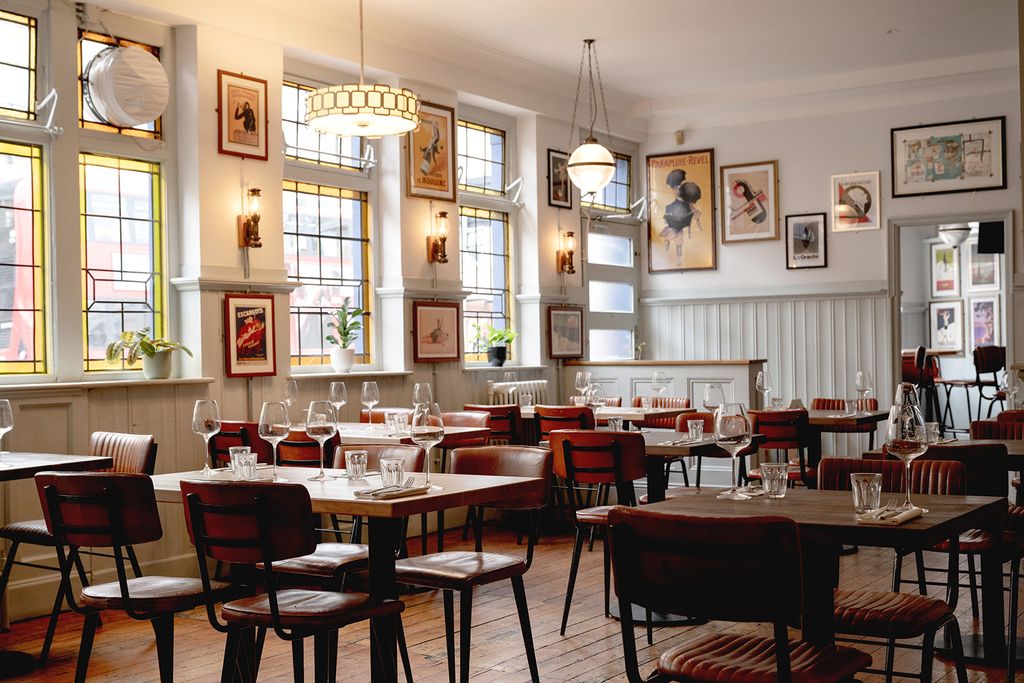 Image may contain Architecture Building Dining Room Dining Table Furniture Indoors Room Table Restaurant and Plant