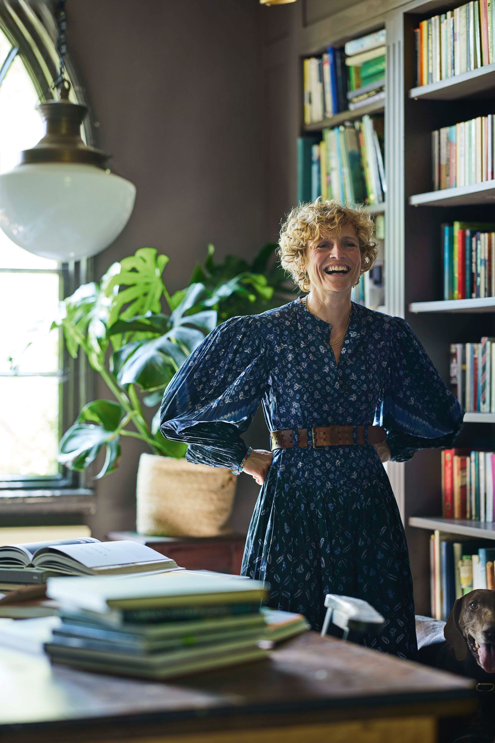 Image may contain Michelle Akers Person Adult Accessories Belt Jewelry Necklace Lamp Desk Furniture and Table