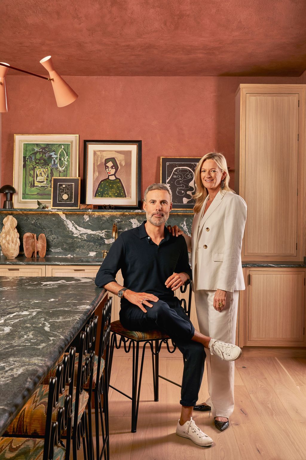 Image may contain Adult Person Clothing Footwear Shoe Wristwatch Art Painting Lamp Sitting Chair and Furniture