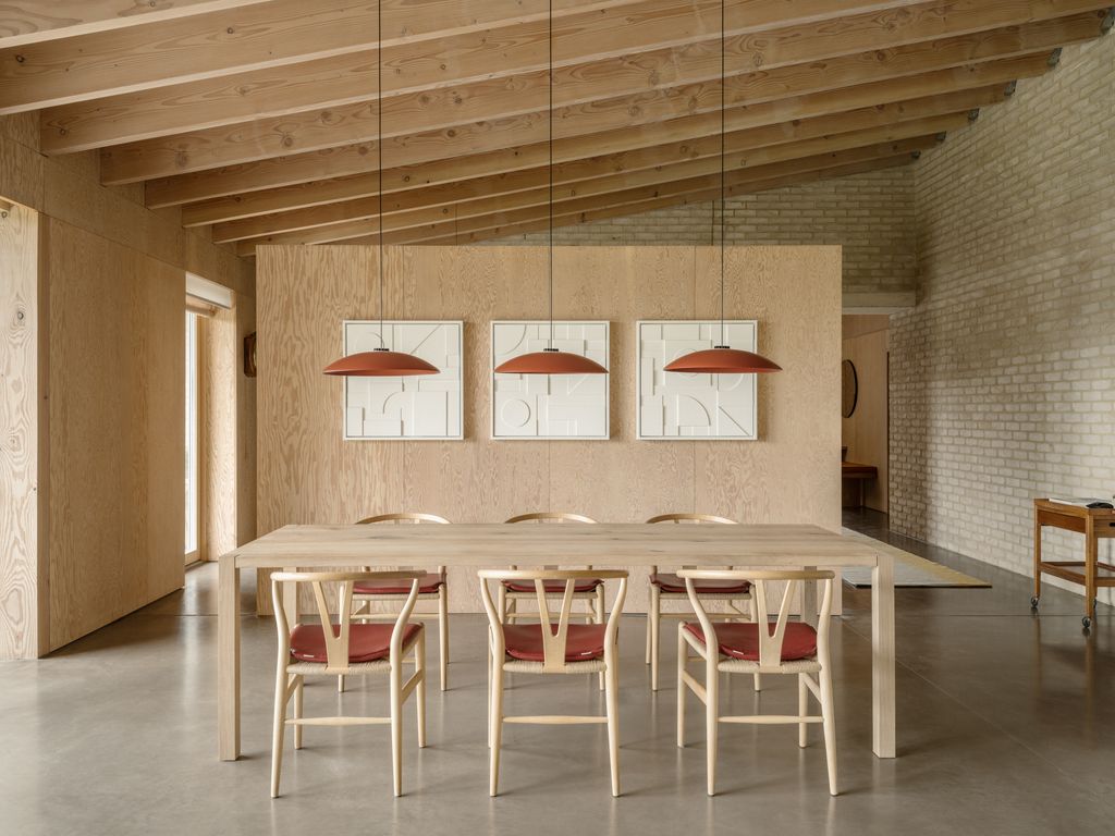 Image may contain Architecture Building Dining Room Dining Table Furniture Indoors Room Table and Interior Design