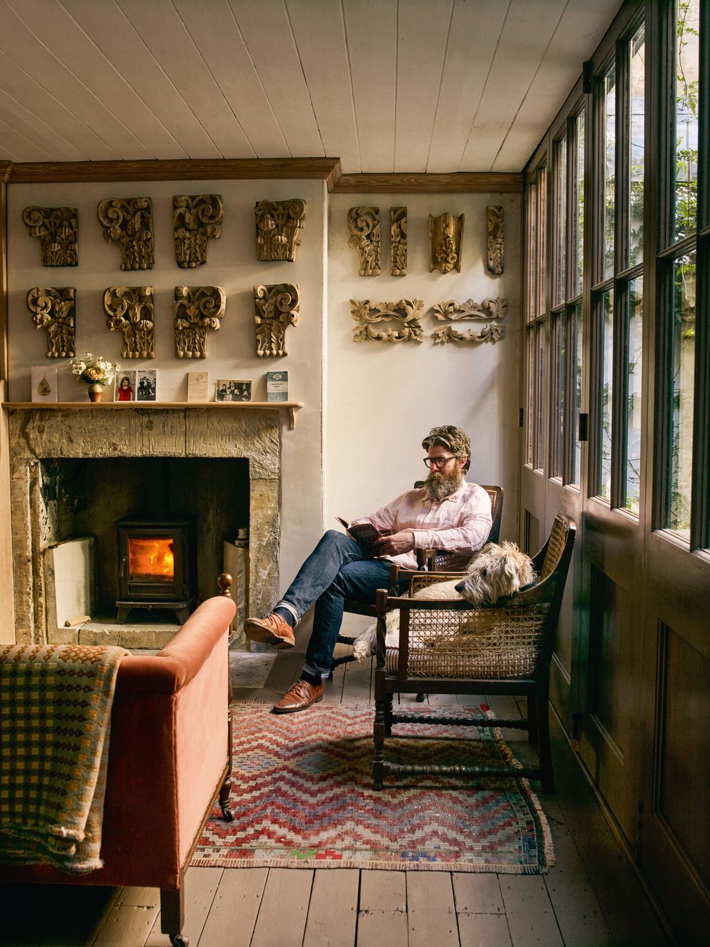 Image may contain Person Sitting Fireplace Indoors Clothing Footwear Shoe Adult Architecture and Building