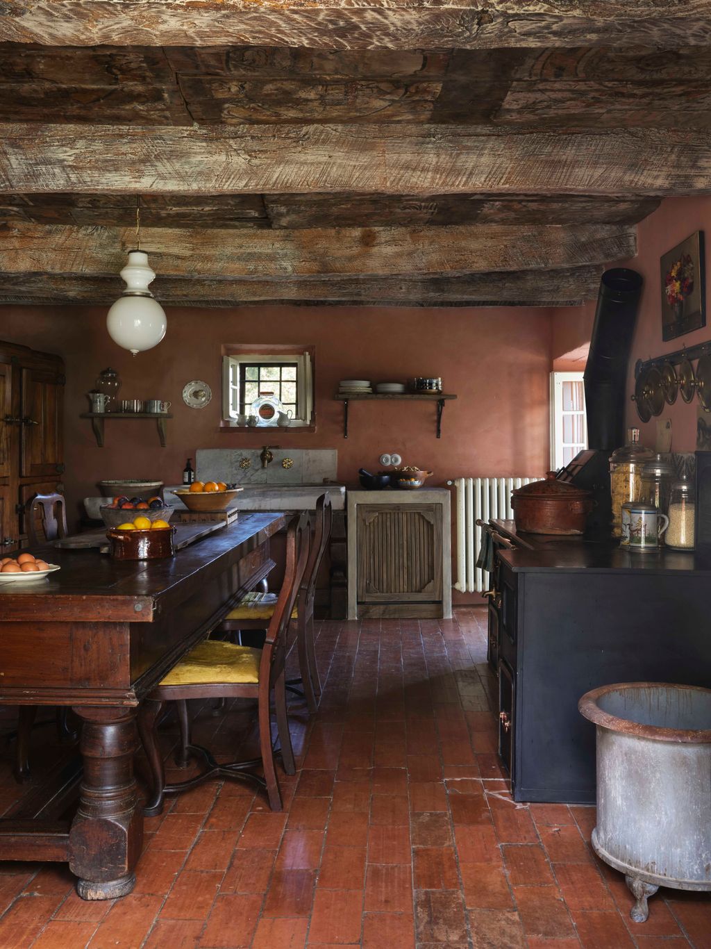 Image may contain Indoors Interior Design Floor Wood Hardwood Flooring Kitchen Cup Chair Furniture and Lamp