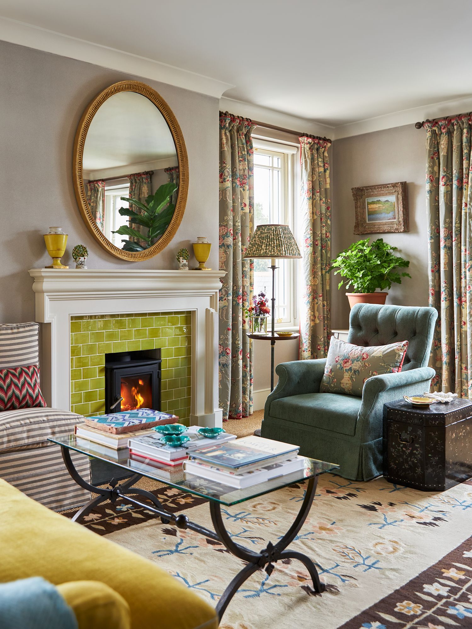 Image may contain Home Decor Plant Fireplace Indoors Art Painting Couch Furniture Table Architecture and Building