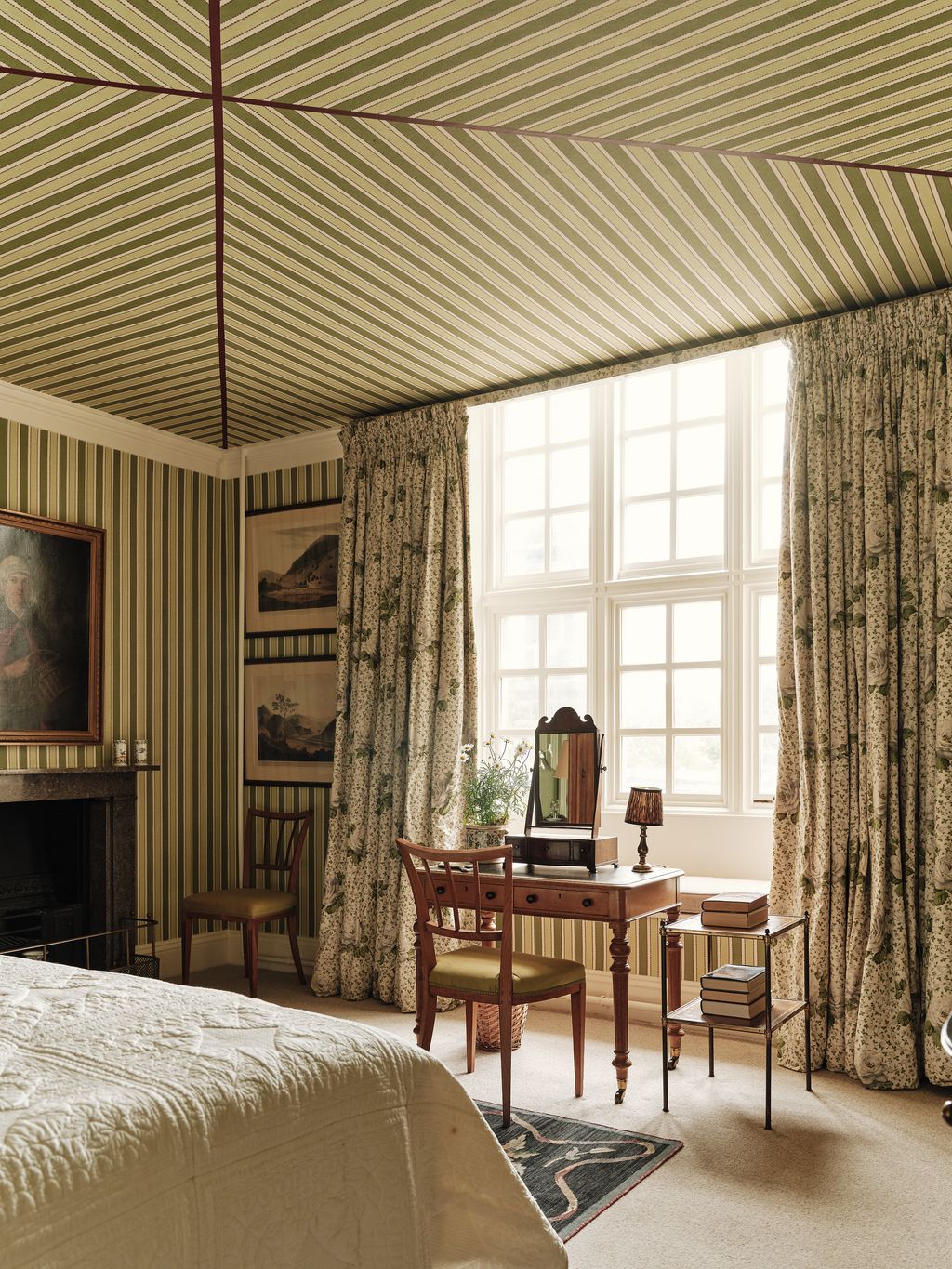 Image may contain Indoors Interior Design Chair Furniture Lamp Art Painting Desk Table Bed Plant and Home Decor