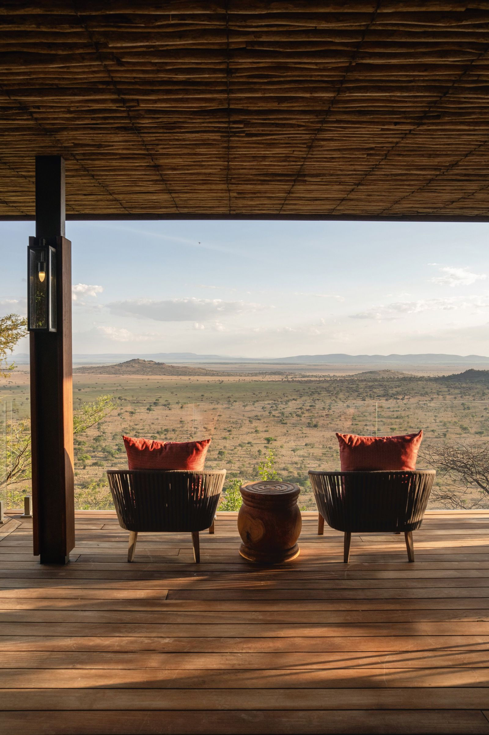 Image may contain Architecture Building House Housing Porch Jar Plant Planter Potted Plant Pottery and Vase