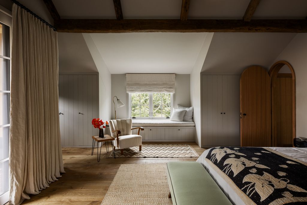 Image may contain Indoors Interior Design Chair Furniture Lamp Home Decor Bed Desk Table Rug Bench and Window