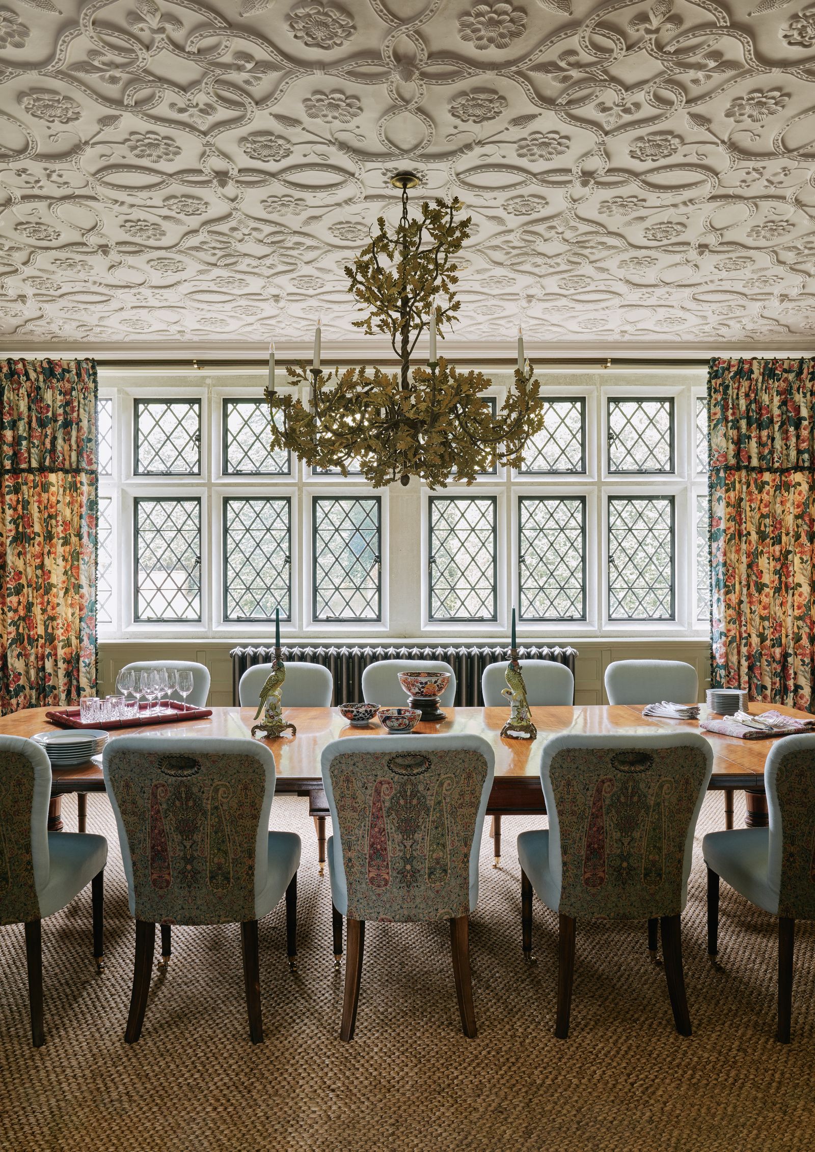 Image may contain Architecture Building Dining Room Dining Table Furniture Indoors Room Table Chandelier and Lamp