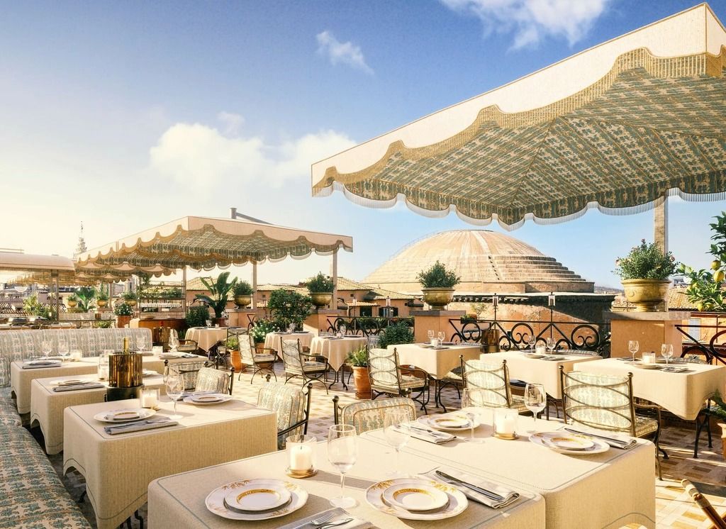 Image may contain La Parka Dining Table Furniture Table Plant Plate Indoors Chair Cup Couch Restaurant and Blade