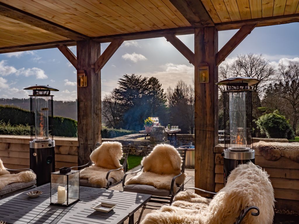 Image may contain Indoors Interior Design Furniture Table Wood Animal Canine Dog Mammal Pet and Candle