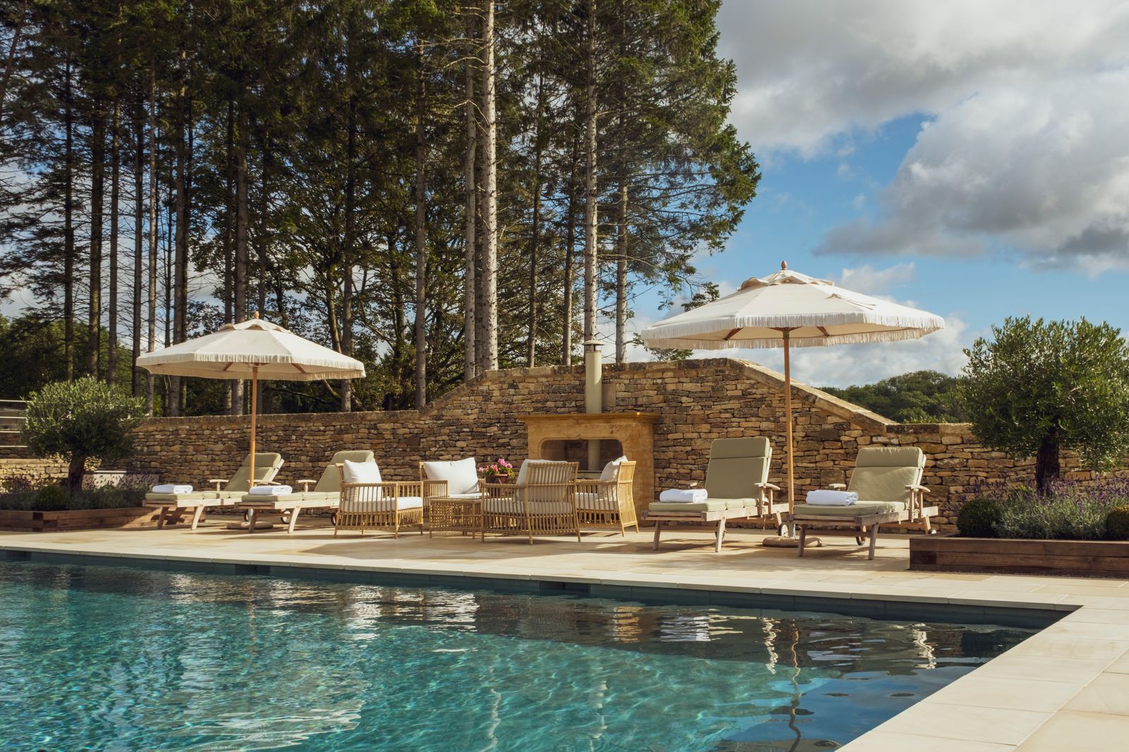 Image may contain Chair Furniture Pool Water Architecture Building House Housing Villa Backyard and Nature