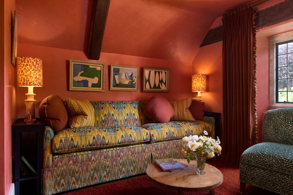 Image may contain Lamp Architecture Building Furniture Indoors Living Room Room Home Decor Couch and Cushion