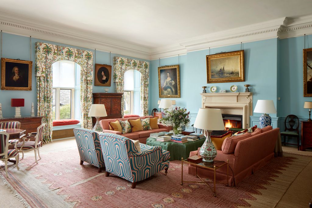 Image may contain Home Decor Lamp Chair Furniture Architecture Building Indoors Living Room Room Art and Painting