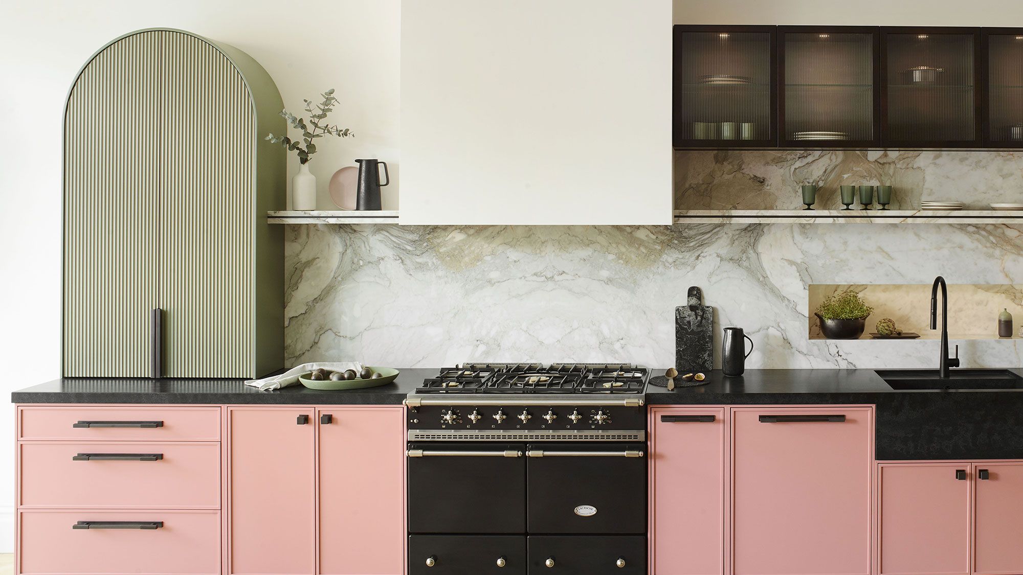 Image may contain: Indoors, Kitchen, Interior Design, Plant, Cooktop, Person, Plate, and Cup