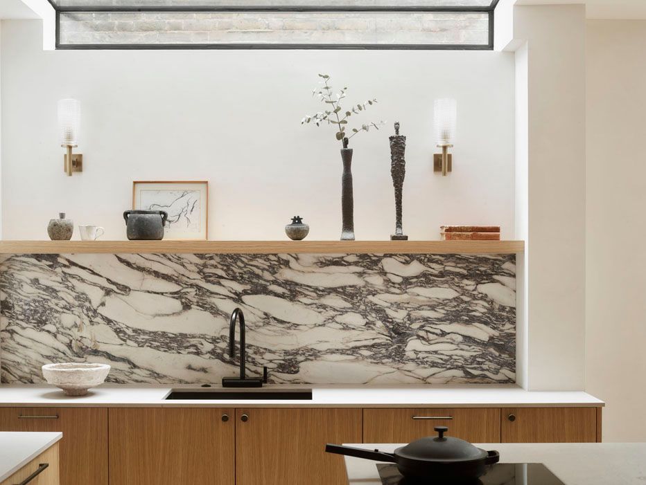 Image may contain: Indoors, Interior Design, Sink, Sink Faucet, Cup, Art, Painting, Plant, Architecture, Building, and Wall