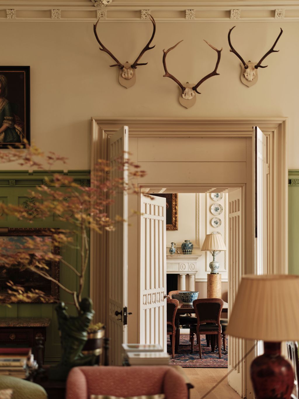 Image may contain Indoors Interior Design Lamp Chair Furniture Architecture Building Living Room Room and Adult