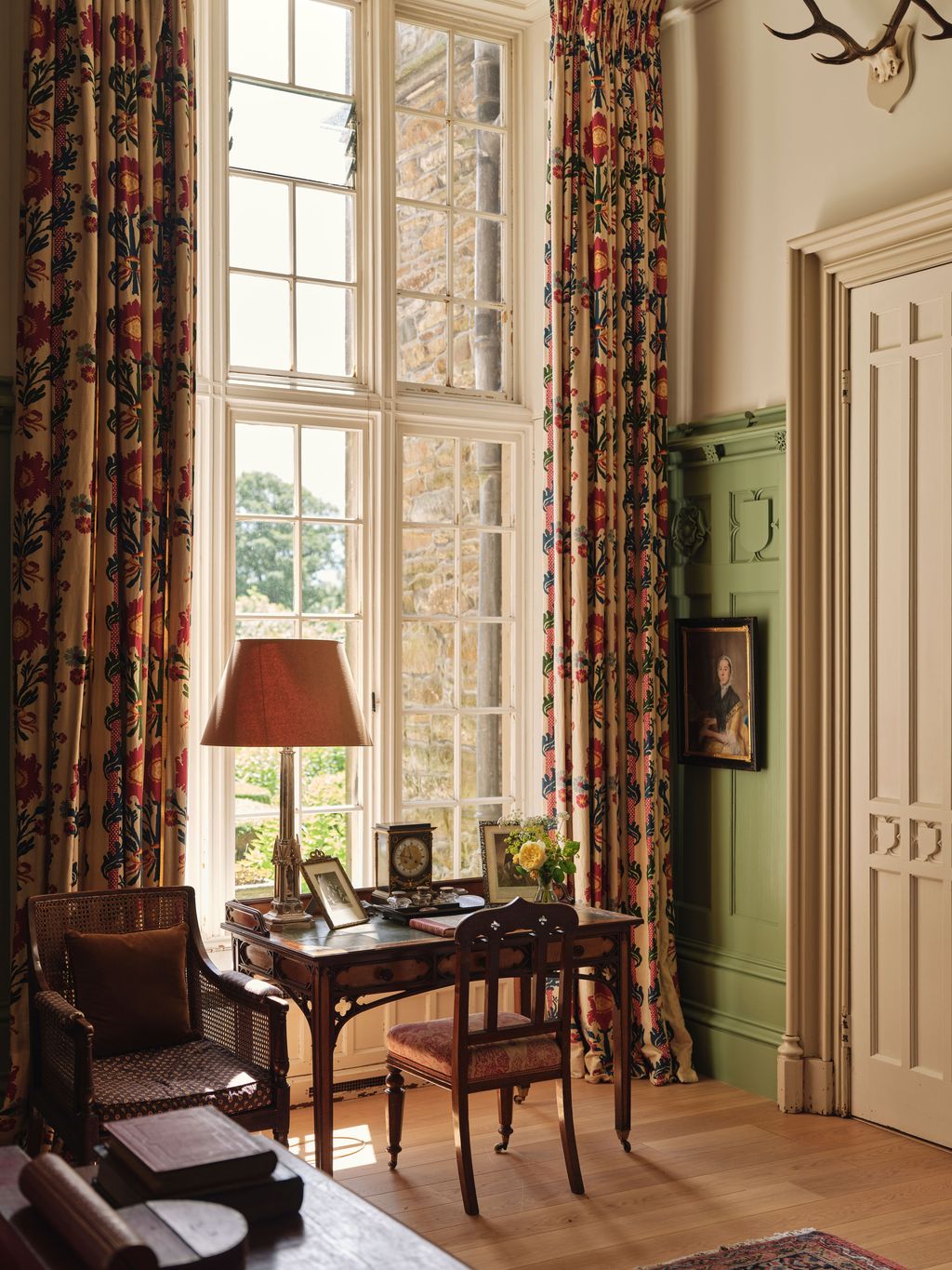 Image may contain Desk Furniture Table Lamp Art Painting Chair Home Decor Rug Indoors Interior Design and Window