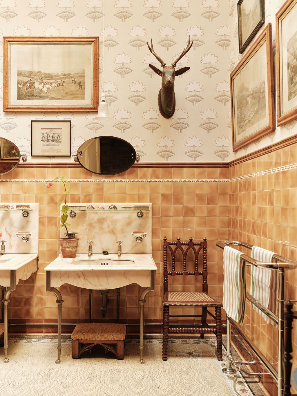 Image may contain Chair Furniture Art Painting Indoors Interior Design Sink Sink Faucet Plant Animal and Antelope