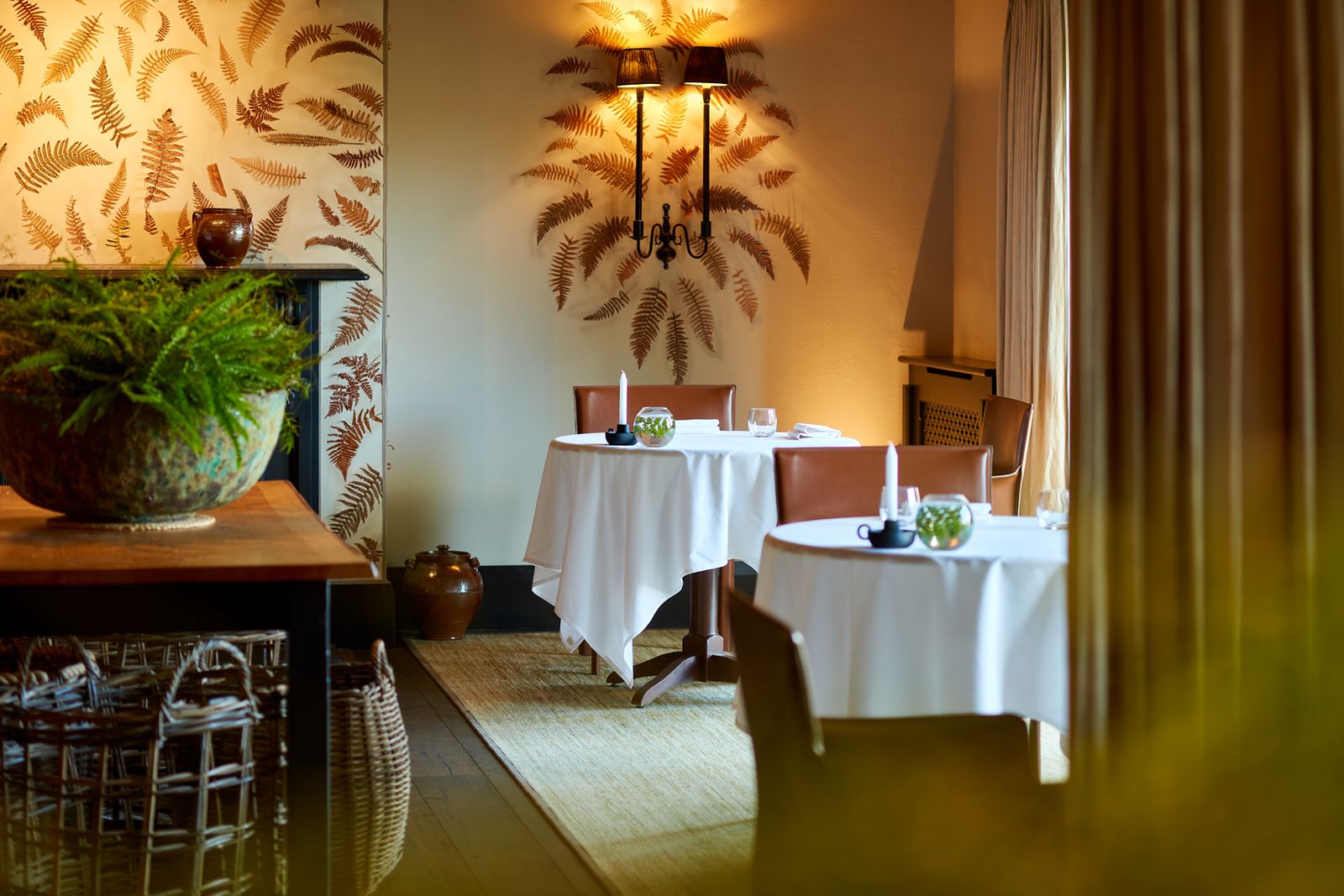 Image may contain Architecture Building Dining Room Dining Table Furniture Indoors Room Table Plant and Chair