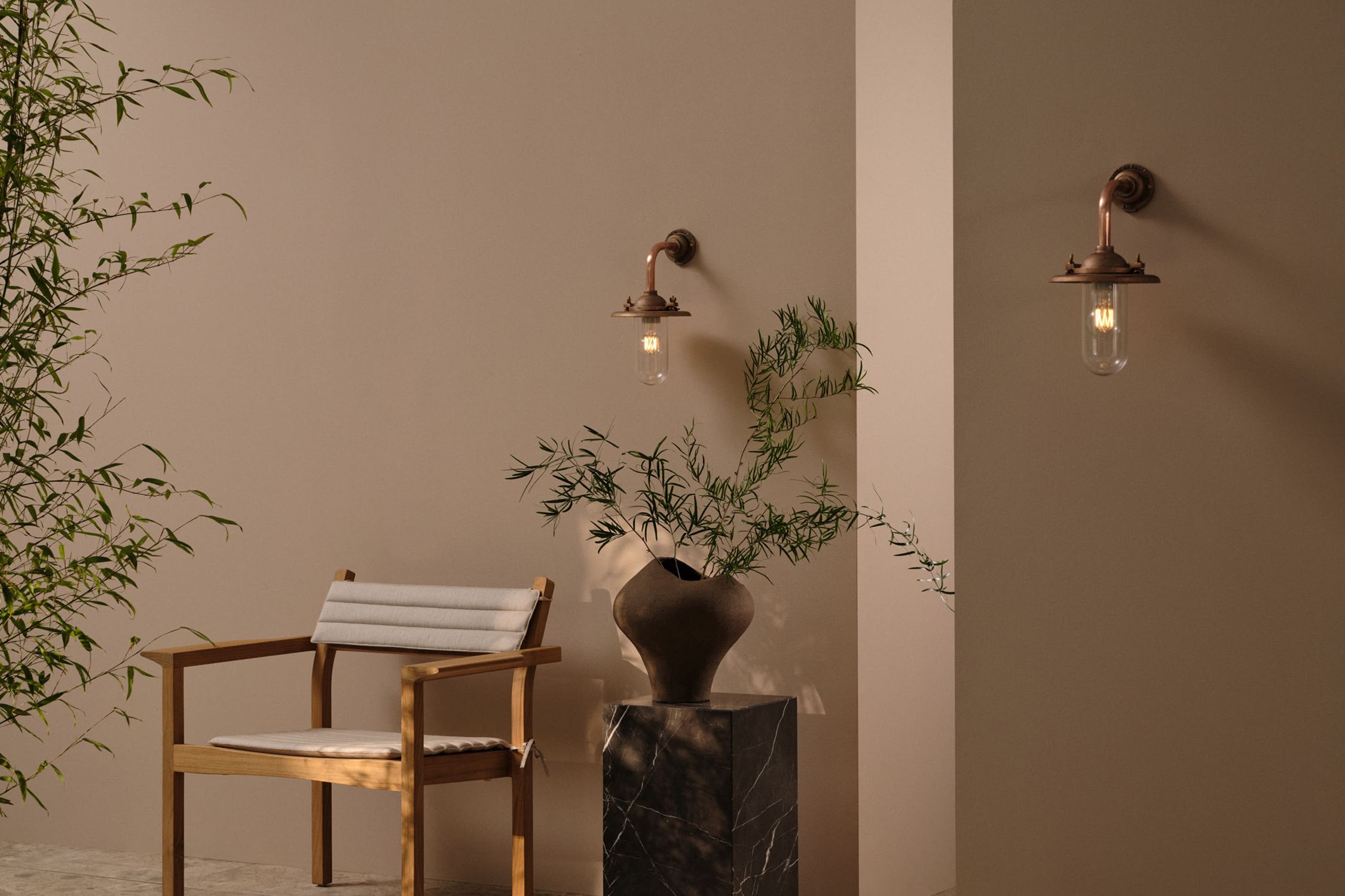 Image may contain: Plant, Potted Plant, Chair, Furniture, Architecture, Building, Wall, Indoors, Interior Design, and Lamp