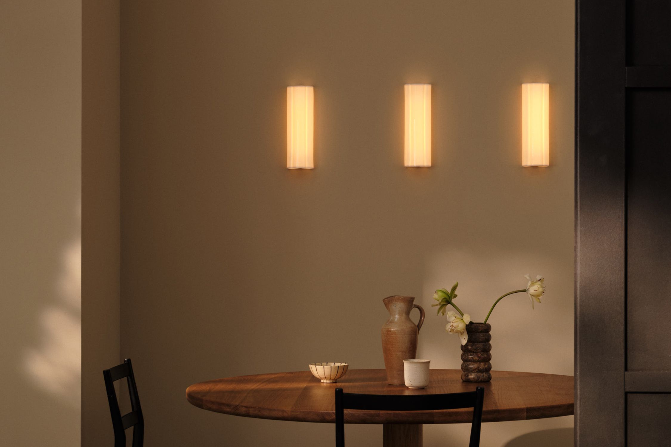 Image may contain: Furniture, Table, Dining Table, Architecture, Building, Dining Room, Indoors, Room, Lamp, Cup, and Chair