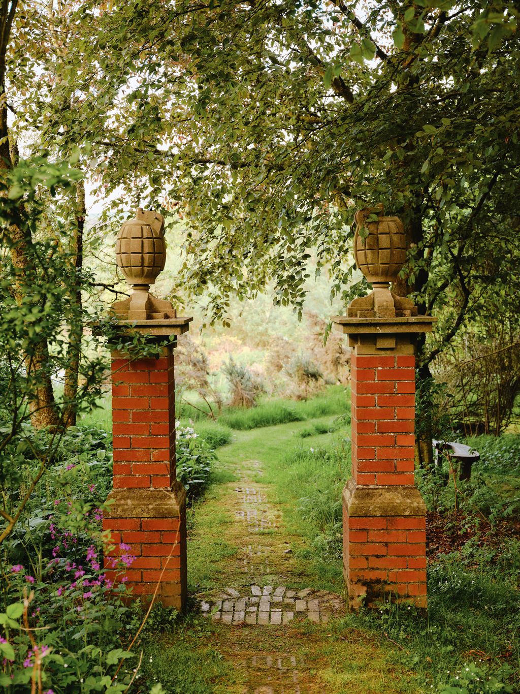 Image may contain Plant Vegetation Brick Land Nature Outdoors Tree Woodland Garden Grass Path Grove and Moss