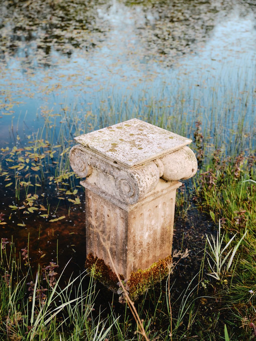 Image may contain Nature Outdoors Pond Water Mailbox Tomb Land and Gravestone