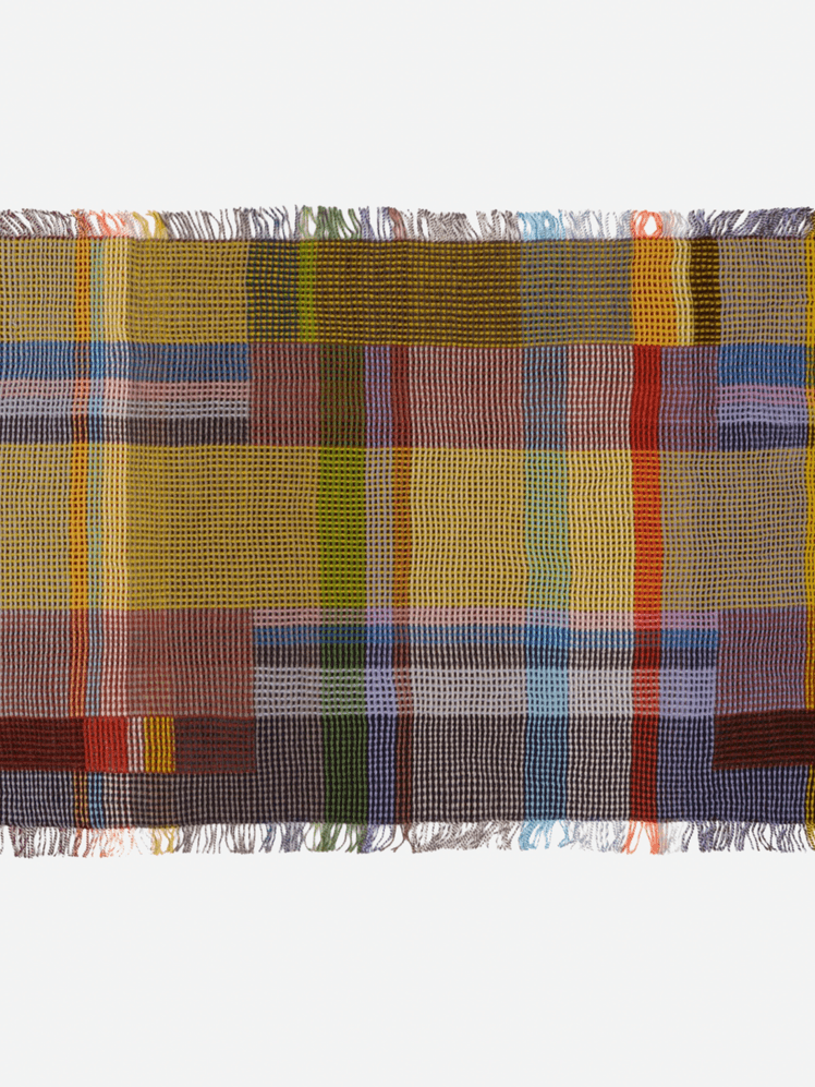 Image may contain: Home Decor, Rug, Clothing, and Skirt