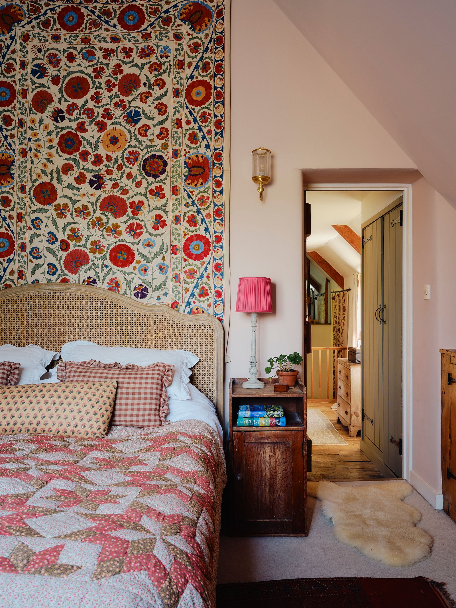 Image may contain Home Decor Lamp Indoors Interior Design Plant Bed Furniture Rug Cushion Bedroom and Room