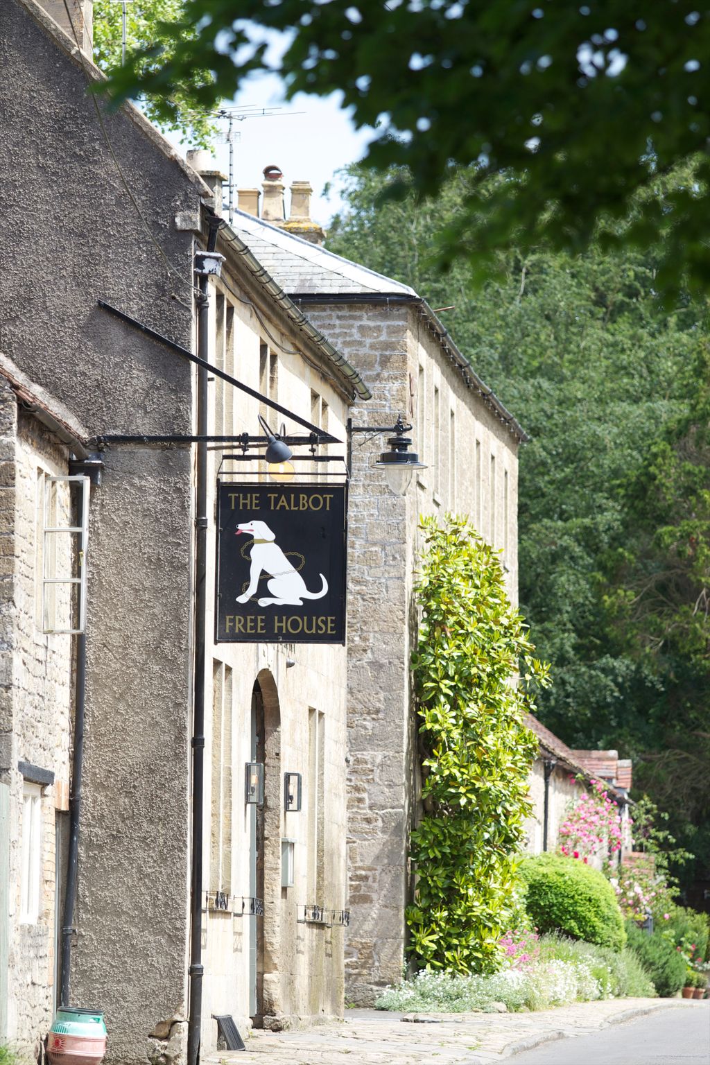 Image may contain Architecture Building Monastery Brick City Road Street Urban Hotel Inn Lamp Path and Sign