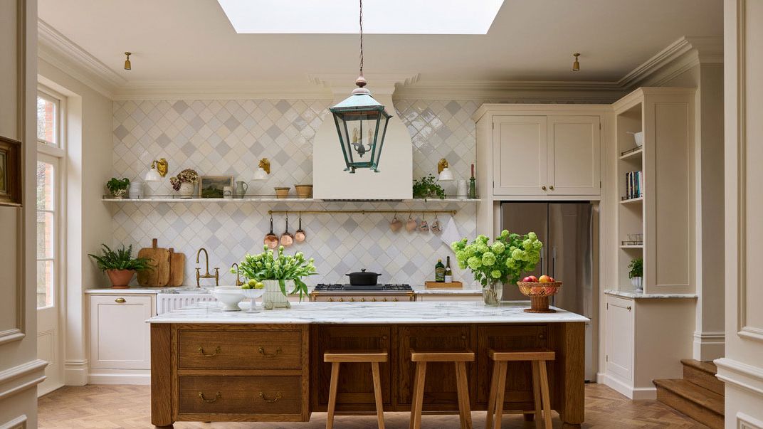 Image may contain: Indoors, Interior Design, Kitchen, Kitchen Island, Plant, Architecture, Building, and Dining Room