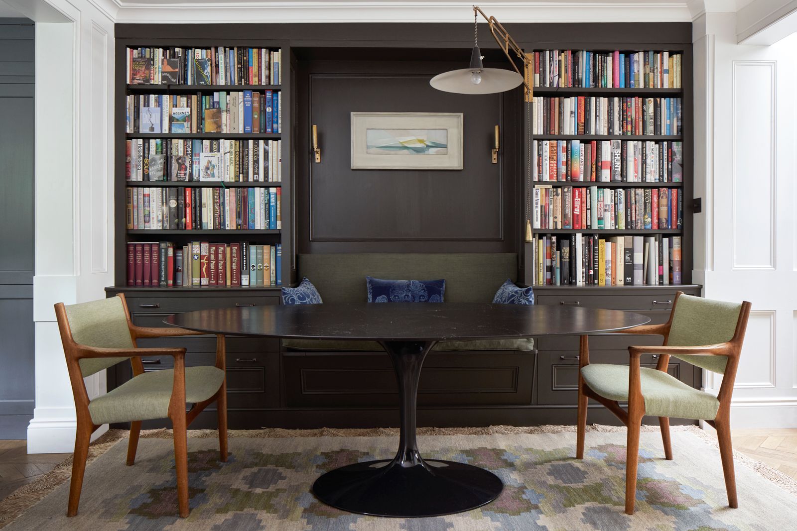 Image may contain Furniture Table Chair Lamp Home Decor Rug Art Painting Bookcase Indoors and Interior Design