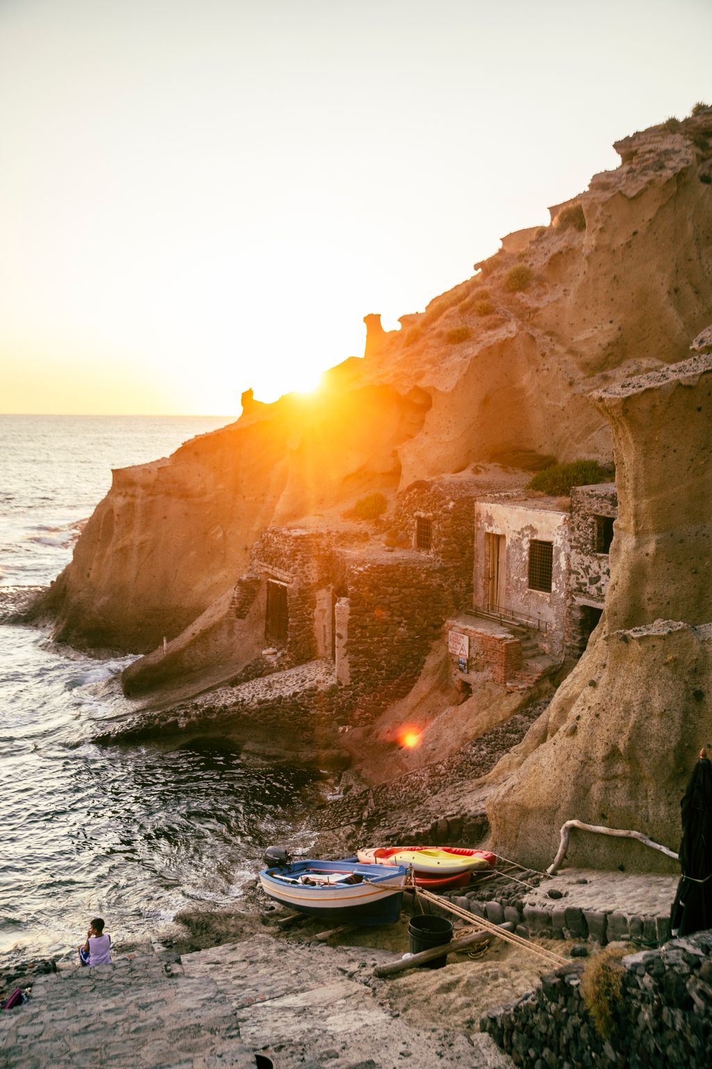 Image may contain Cliff Nature Outdoors Rock Sky Boat Transportation Vehicle Sea Water Architecture and Building